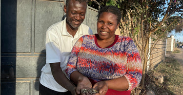 Meet the makers, jewellery artisans Anton and Benta hold brass charms from AARVENs jewellery collection outside their home in Nairobi