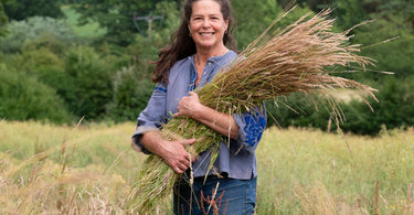 Basketry artist and author Ruby Taylor harvesting wild grass, photography by Sam Green