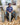 Person sitting on a chair holding a woven toilet roll holder with more in the background.