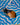 Decorative fish figure on a blue and white wavy patterned surface