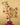 Decorative tree with colorful ornaments against a beige background