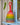 Rainbow woven rattle toy with a handle on a shelf