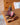 Fig on a wooden cutting board with a wooden surface in the background