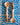 Two wooden spoons on a blue and white wavy patterned tile background