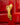 Gold door handle shaped like a lobster on a red door