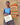 Ghanaian artisan posing with handmade woven lightshades.