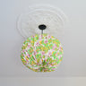AARVEN Origami Paper Lightshade Globe Water Lilies hanging as a pendant lightshade ceiling feature in a modern living room.