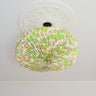 Handcrafted origami paper lightshade hanging in modern living room