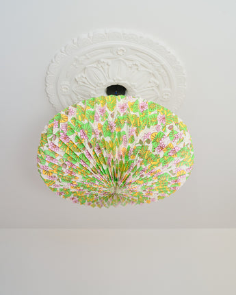 Handcrafted origami paper lightshade hanging in modern living room