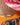 Close up of AARVEN paper light shades against an orange wall.