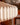 Close-up of a modern pleated paper light shade by AARVEN in a warm cream tone, with a softly blurred indoor background.
