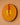 Decorative small African sun mask in yellow and orange with geometric design on a peach background