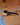 Black measuring spoon on a wooden surface