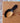 Wooden scoop with black handle on a wooden surface