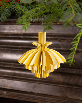 Yellow paper ornament for festive holiday decoration. Handmade sustainable eco christmas decor.