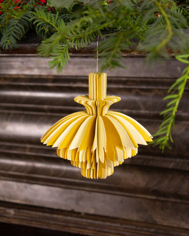 Yellow paper ornament for festive holiday decoration. Handmade sustainable eco christmas decor.