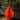 Orange paper ornament hanging against a decorative background with greenery and red berries.