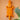 Orange geometric crocodile wall art, hand carved in Ghana, with a plant in the foreground on a peach background