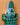 Decorative hand carved crocodile wall art with a blue and green geometric design on a peach background