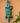 Green and blue geometric wall art crocodile carving, handmade by Ghanaian artisans on a peach background