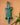 Green and blue geometric wall art crocodile carving, handmade by Ghanaian artisans on a peach background