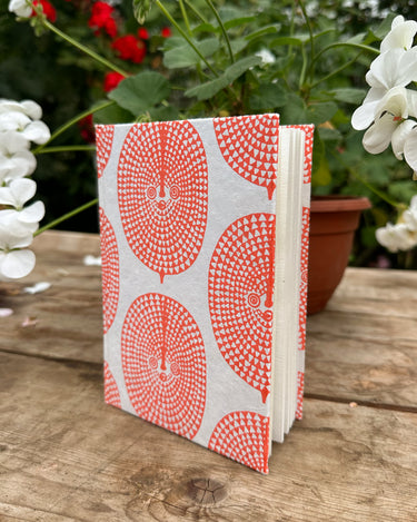 Hand Printed Hardback A5 Notebook 'Orange Sun Mask'