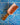 Wooden spatula on a blue tiled wall with wavy patterns