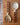 Wooden fork and spoon with chevron pattern handles on a wooden surface.