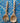 Wooden spoon and fork on a blue and white patterned tile background