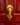 Gold lobster shaped novelty door knocker on a red door