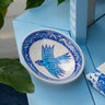 AARVEN decorative ceramic soap dish with blue bird design on a blue surface