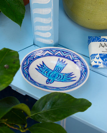 AARVEN hand painted luxury ceramic soap dish with blue bird design on a blue surface