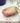 AARVEN handmade pink soapstone soap dish on a tiled surface.