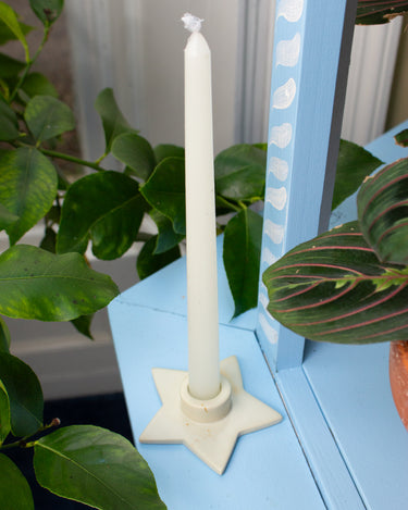 Handmade star shaped dinner candle holder in soft white soapstone. Ethical gift.