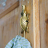 Handcrafted Ghanaian Ashanti brass hook featuring crocodile design