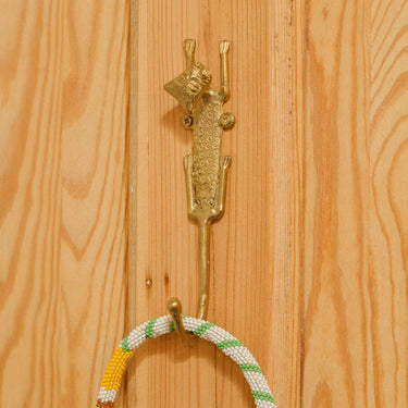 Brass wall hook featuring a detailed leopard motif for home decor