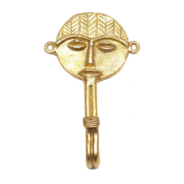 Decorative brass wall hook for coats, keys, or curtains with mask detail