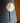 Solid brass wall hook with traditional sun mask pattern for home decor