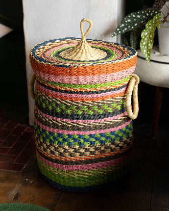 Handwoven African basket ideal for laundry or home storage.