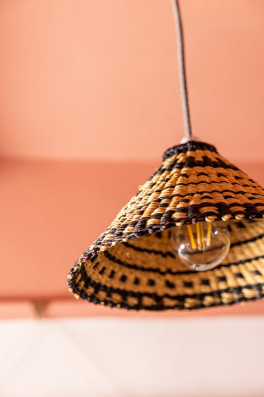 Close up of AARVEN Natural pendant light shade hand made by Ghanaian artisans in natural and black