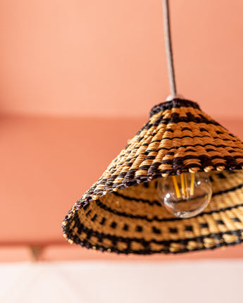 Close up of AARVEN Natural pendant light shade hand made by Ghanaian artisans in natural and black