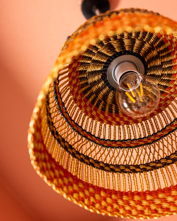 Textured wicker-style lightshade adding an organic touch to home decor.