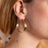 Statement Kilifi hoops in brass with a rustic hammered metal look.