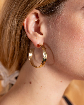 Statement Kilifi hoops in brass with a rustic hammered metal look.