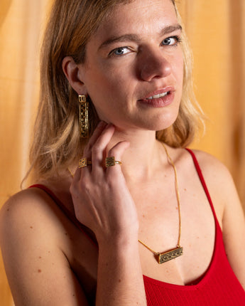 Elegant brass geometric Harakati necklace by AARVEN for versatile styling.