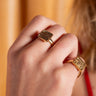 Handcrafted Harakati ring from AARVEN featuring sleek brass shapes and modern style.