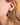 Elegant Almasi brass earrings by AARVEN with distinctive geometric detailing.