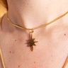 AARVEN Hammered Star necklace featuring a textured brass star pendant.