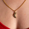 Elegant AARVEN Hammered moon necklace with shimmering hammered finish.