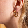 Handcrafted Sprite Earrings showing tactile textures and artisanal detailing.